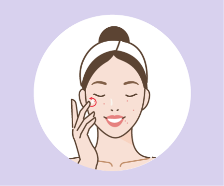 Woman applying a product on her face  Card image of a woman applying a product on her face